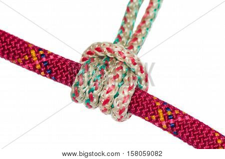 Prusik knot. white rope is wrapped around the red. Isolated on white background.