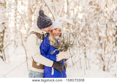 The Guy And The Girl Have A Rest In The Winter Woods.