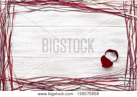 Frame for valentine's day, Birthday, Mother's Day, Wedding Day . Top view with copy space. Photos for posts, blogs, advertising and news. White wooden background with frame. Greeting concept card