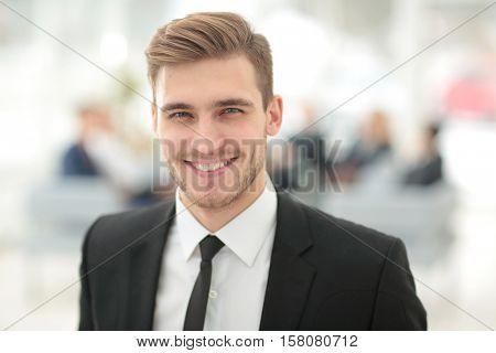 Portrait of happy businessman with  colleagues interacting on ba