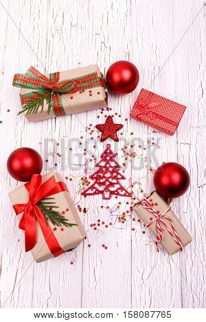 Beautiful Christmas Decorations And Packeged Gift Boxes Lying On White Floor