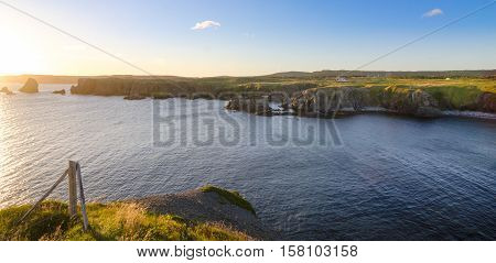 Cape Bona Vista coastline in Newfoundland, Canada.  Panoramic vista, bright blue late summer morning over Atlantic Canada.