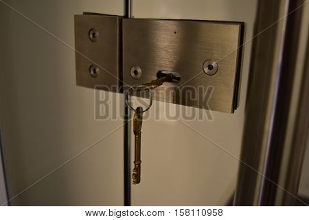 KEYS CHAIN KNOB, AND LOCKED GLASS DOOR