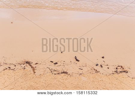 Sea water at beach when low tide after sunset can be used as background