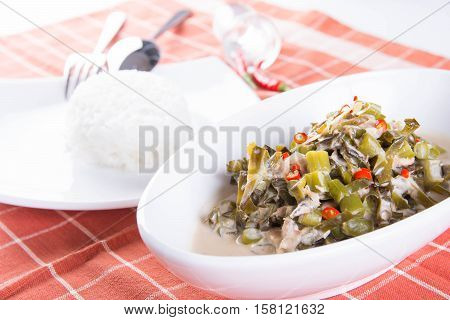 chopped legumes and winged beans in bagoong sauce