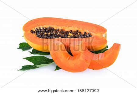 half cut ripe papaya with seed on leaf with white background