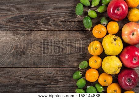 Mixed exotic fruits on wooden background. Close up