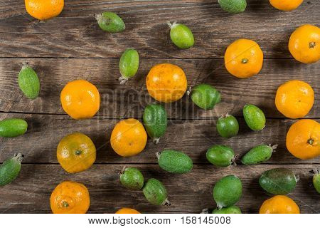 Mixed exotic fruits on wooden background. Close up