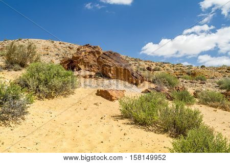 Boulders on the hill in Makhtesh Gadol or Large Crater nature reserve in Negev desert Israel