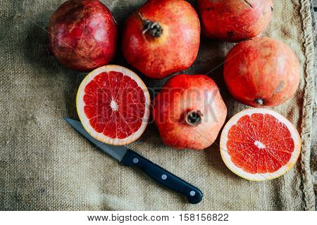 Ripe Pomegranate Fruit On Wooden Vintage Background. Red Juice P