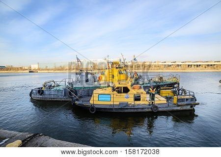MOSCOW, RUSSIA - NOVEMBER 11, 2016: State Unitary Enterprise Mosvodostok performs recovery vessels on coastal winter parking. Ships Mosvodostok on the Moscow River.