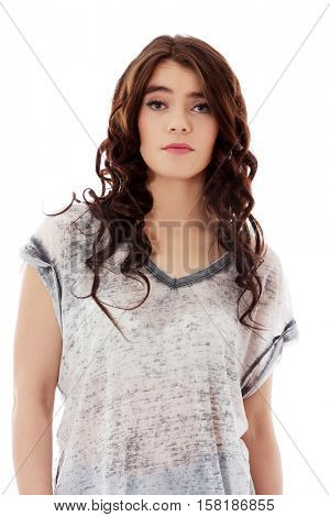 Young unhappy woman with long dark hair.
