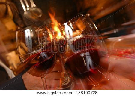 Wining with friends Four friends cheering Drinking wine in a restaurant France