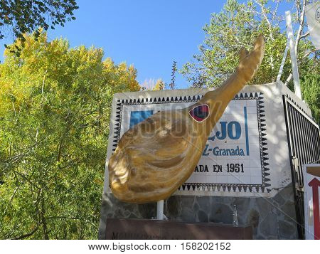 Trevelez Spain - October 31 2016: Large Spanish Ham advertising a wellknown Salting and Drying Business