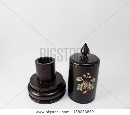 The wooden round box made of aromatic wood and dye them black with the silver and pearl engraving.