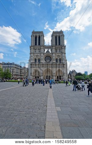 People At Notre Dame De Paris Cathedral In Paris France