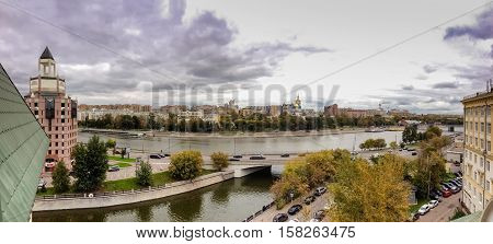 MOSCOW, RUSSIA - SEPT 27, 2016: Panoramic view to Moscow river Shluzovaja Embankment at spit of Bolotny island and Vodotvodni Canal in Moscow, Russia on Sept 27, 2016.