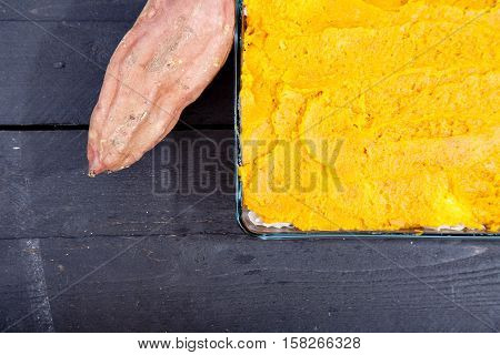 Oven Meal With Sauerkraut And Sweet Potato On Wooden Background