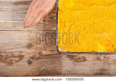 Oven Meal With Sauerkraut And Sweet Potato On Wooden Background