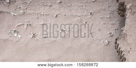 Texture of the old, dilapidated wall cracks.