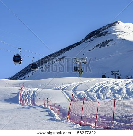 Gondola Lift On Ski Resort At Sun Winter Day