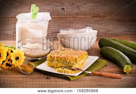 Rice timbale with zucchini on white dish.