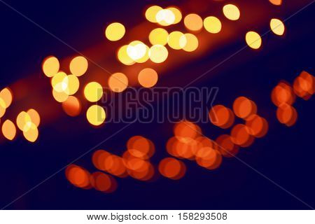 Abstract colorful blurry background cold and warm colors tone cinematic effect evening night street romantic lights