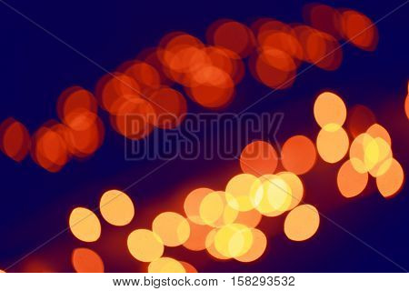 Abstract colorful blurry background cold and warm colors tone cinematic effect evening night street romantic lights