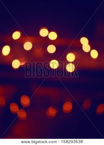 Abstract colorful blurry background cold and warm colors tone cinematic effect evening night street romantic lights