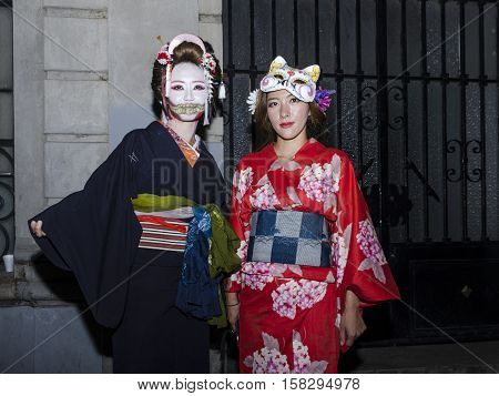 OAXACA, OAXACA, MEXICO - NOVEMBER 1, 2016: Geisha girls at traditional day of the dead parade in Oaxaca, Oaxaca, Mexico
