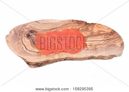 Smoked wild pacific sockeye salmon on olive wood cutting board