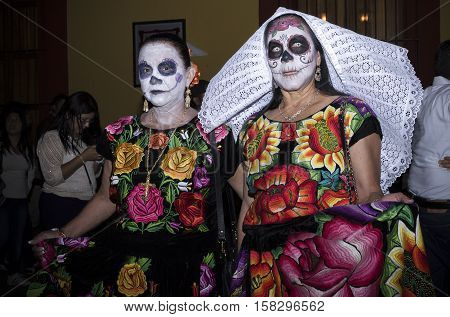 OAXACA, OAXACA, MEXICO - NOVEMBER 1, 2016: Catrinas as tehuanas costume at traditional day of the dead parade in Oaxaca, Oaxaca, Mexico