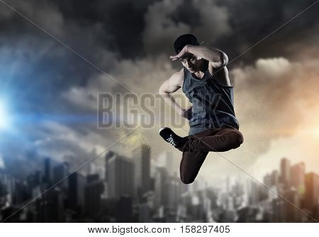 B-boy performing some moves . Mixed media
