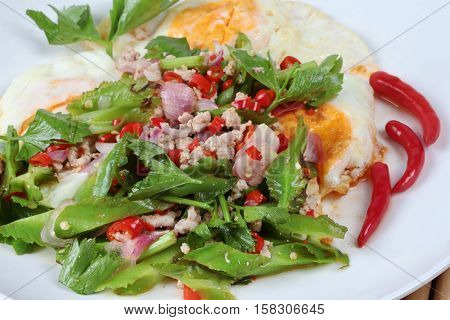 Thai Food,spicy Wing Bean With Pork Topped Fried Egg.