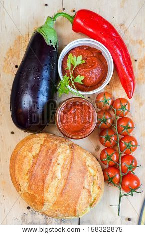 Raw beef meat.Beef steaks with vegetables and spices on a wooden floor