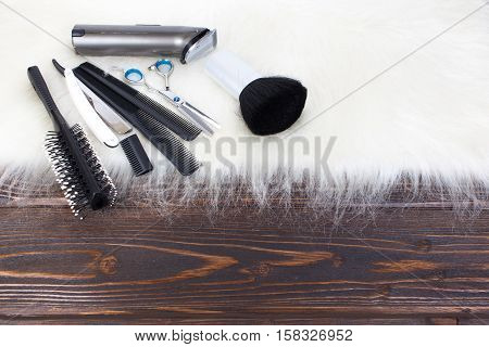 Hairdresser set with various accessories on background