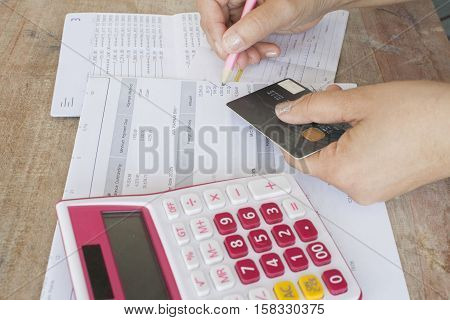 hand checking document monthly expense credit card