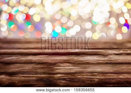 Old Empty Table With Christmas Lights In The Background