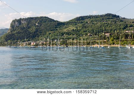 Sailboats at Porto di Bardolino harbor on The Garda Lake . Italy