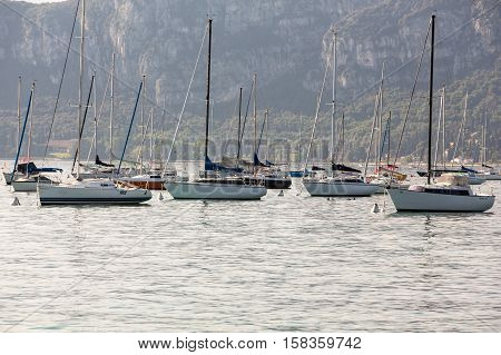 BARDOLINO, ITALY - MAY 4, 2016: Sailboats at Porto di Bardolino harbor on The Garda Lake . Italy