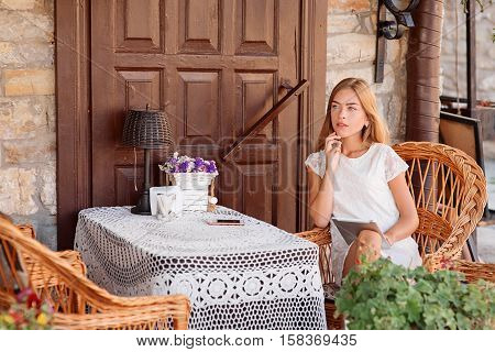 Young Woman In Caffee Looking Aside