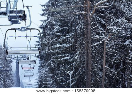 Winter forest snow ski lift trace mans on snow background