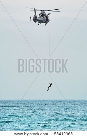 VARNA BULGARIA - November 09 2016: Lifting of Diver on Helicopter Eurocopter AS565 Panther during an Exercise in the Bay of the Black Sea