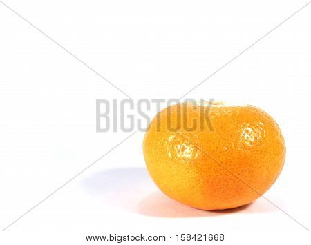 Close-up of one ripe vivid color orange isolated on white background