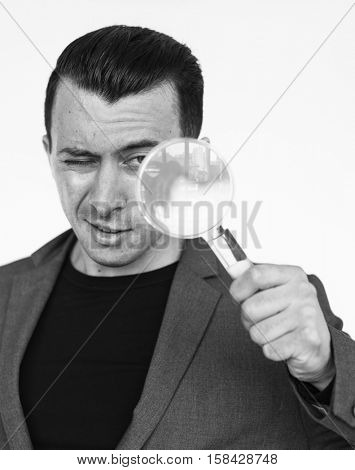 Caucasian Business Man Magnifying Glass Concept