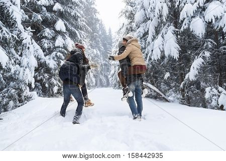 Friends Group Two Playful Couple Snow Forest Young People Outdoor Winter Pine Woods