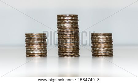 Three of standing coin on the white background