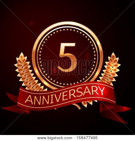 Five years anniversary celebration with golden ring and ribbon.