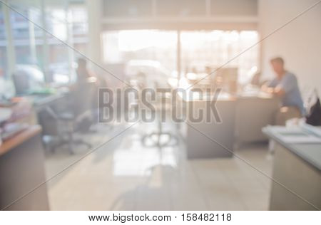 Businessmen blur in the workplace.Table Top And Blur Office of Background.abstract blur background table work in office with computer.Abstract background of office shallow depth of focus  silhouette.