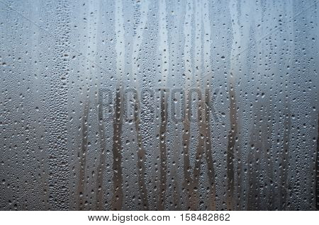 Natural water drop on a window background.